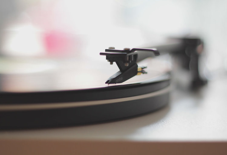 A closeup of a vinyl record player.