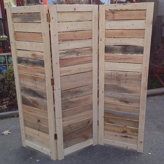 A DIY pallet wall standing up.