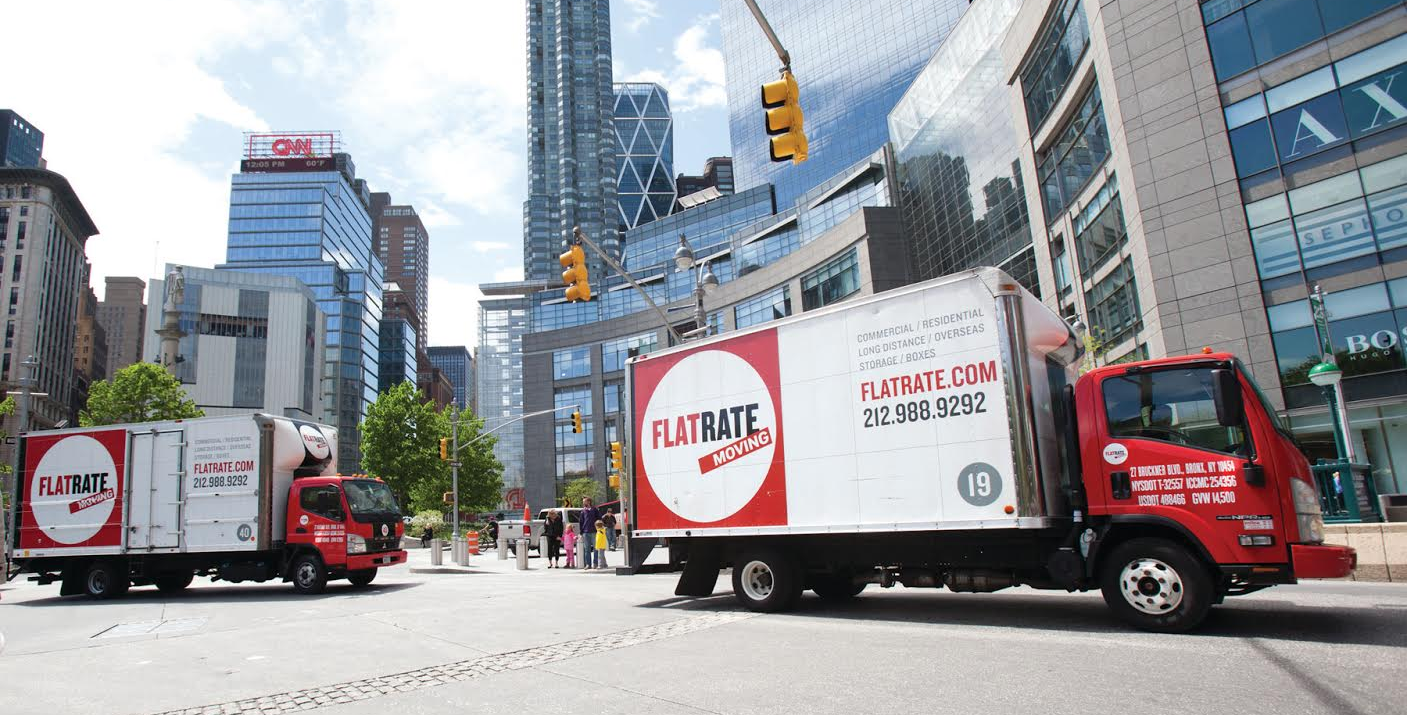 A FlatRate Moving truck on the streets of NYC.