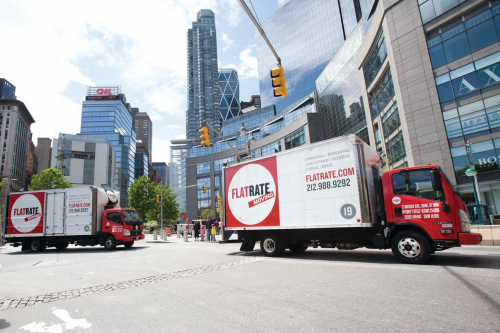 A FlatRate Moving truck on the streets of NYC.