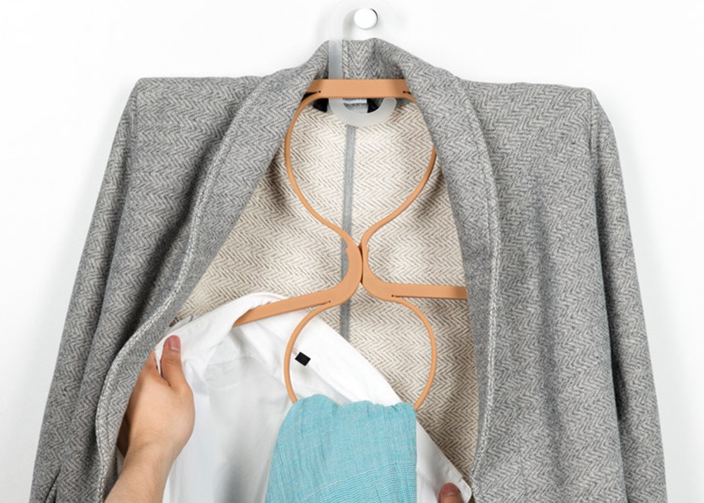 Ivan Zhang's elastic Hanger turns into 2 hangers with 2 loops for more clothes storage.