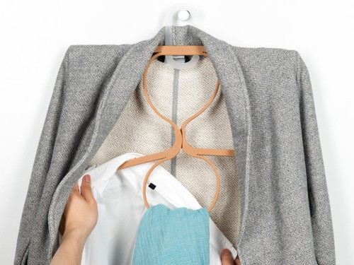 Ivan Zhang's elastic Hanger turns into 2 hangers with 2 loops for more clothes storage.