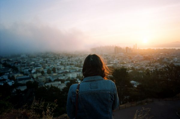 photo taken by ike edeani of a woman overlooking a city