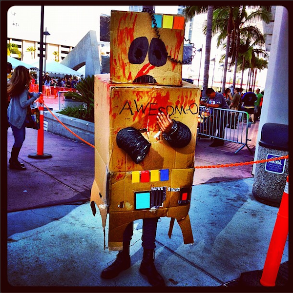 A person is wearing an Awesome-O Halloween costume covered in blood.