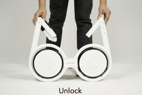 The white Impossible folding electric bike is being unlocked.