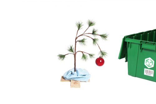 A 24-inch Charlie Brown Christmas Tree and a MakeSpace storage bin on the side.