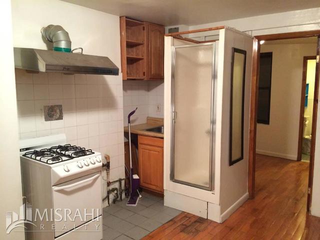 Shower-in-kitchen apartment at 27 Orchard Street in Chinatown, New York City.