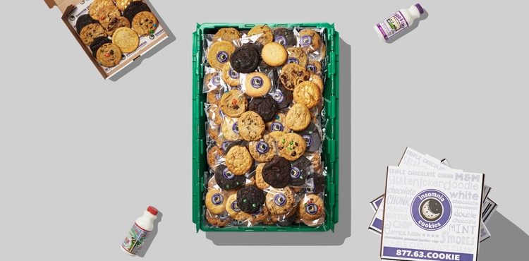 A green MakeSpace storage bin is full of Insomnia Cookies from NYC.