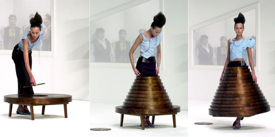 Fashion Designer Hussein Chalayan created a modern coffee table with storage skirt.