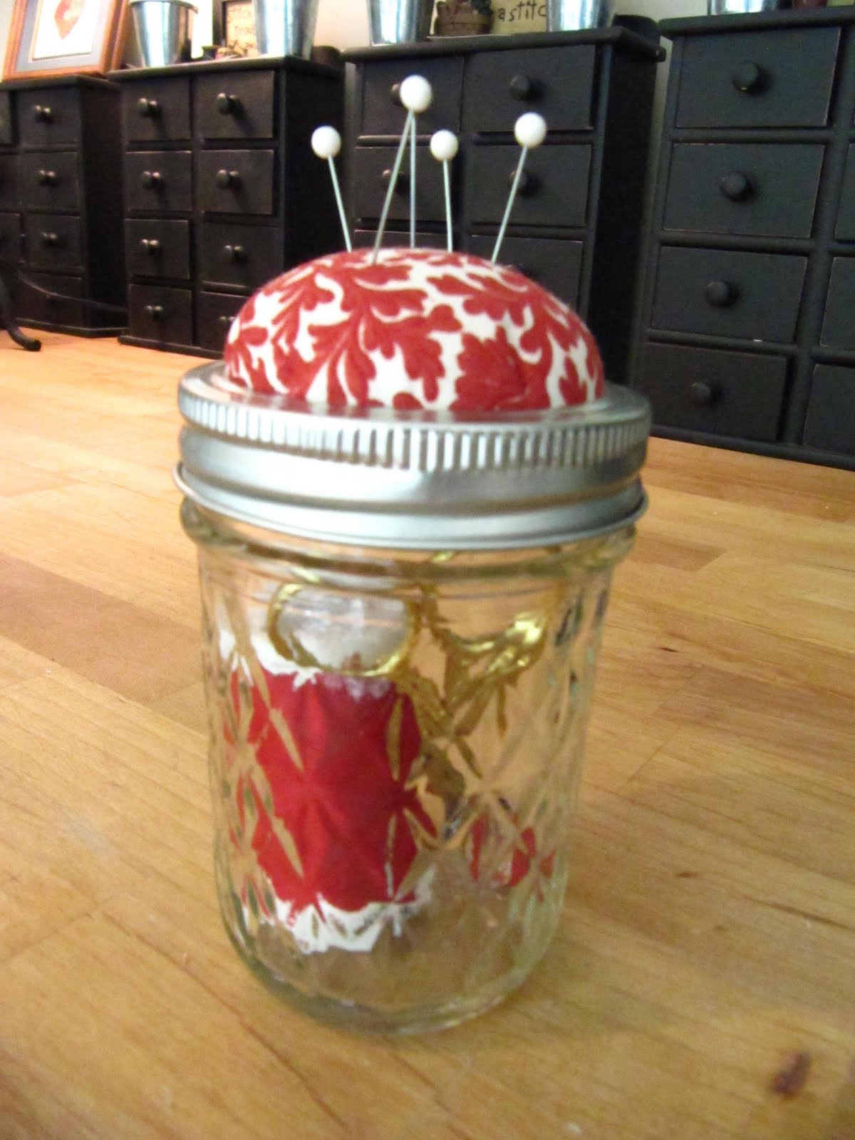 A DIY mason jar is the perfect sewing supplies storage that also saves space in a small apartment.