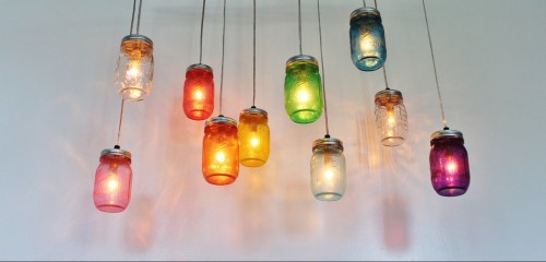 This genius DIY mason jar chandelier shines a rainbow in your tiny apartment.