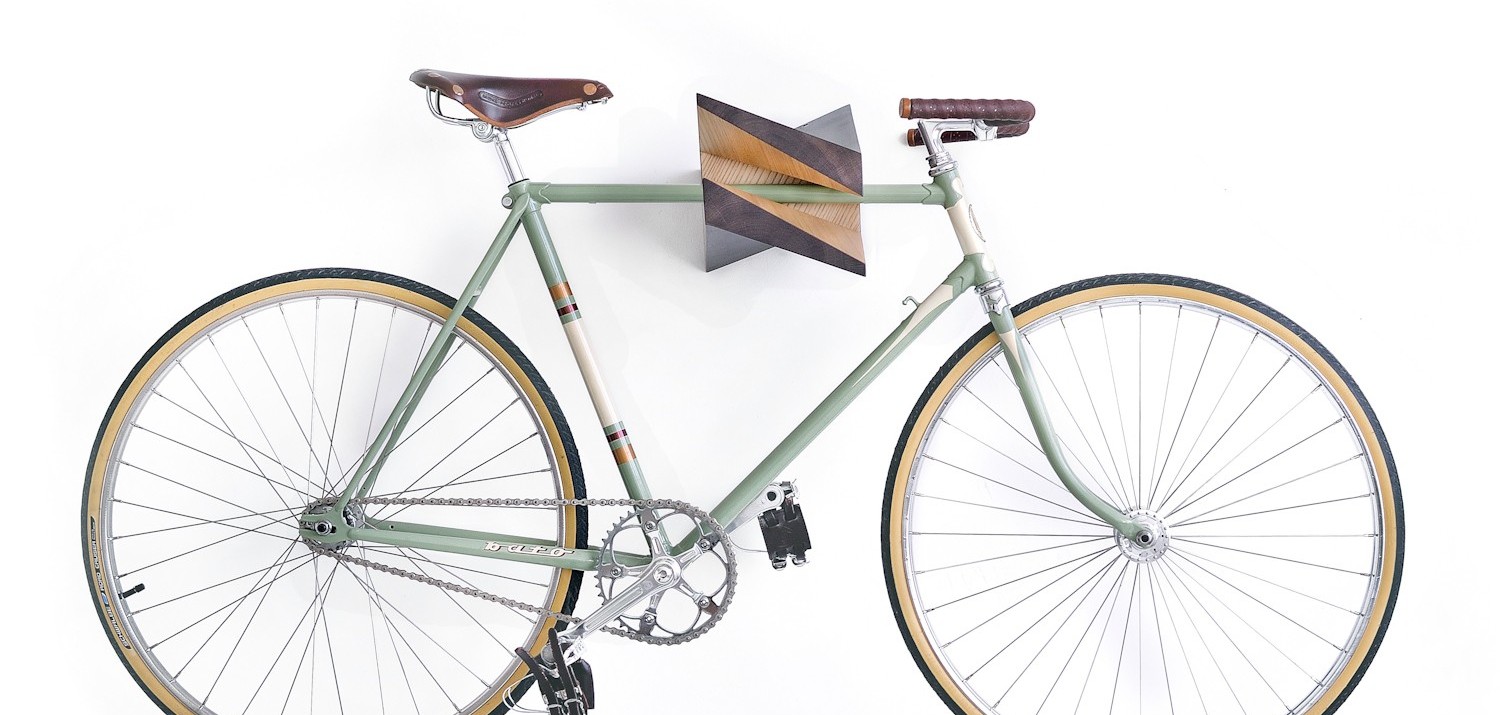 The wooden Iceberg Chestnut is an X-shaped bike storage rack that doubles as fine art.