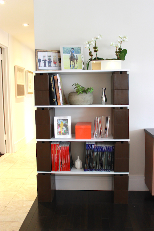 A LEGO bookcase made of brown EverBlocks.