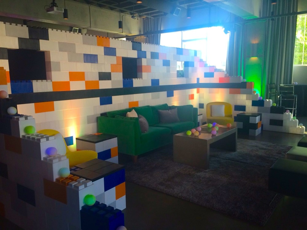 A living room with multicolored LEGO walls made of EverBlocks. 