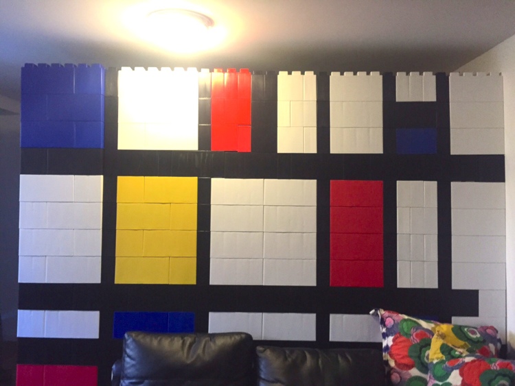 A Piet Mondrian wall made of white, black, blue, red, and yellow EverBlocks.