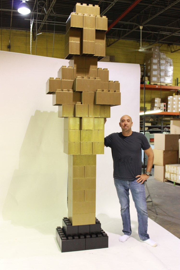 A giant gold Oscar award built with EverBlocks that look like big LEGOs.