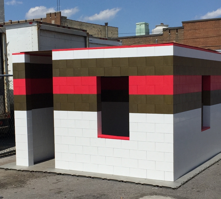 A giant LEGO castle made of white, red, and brown EverBlocks.