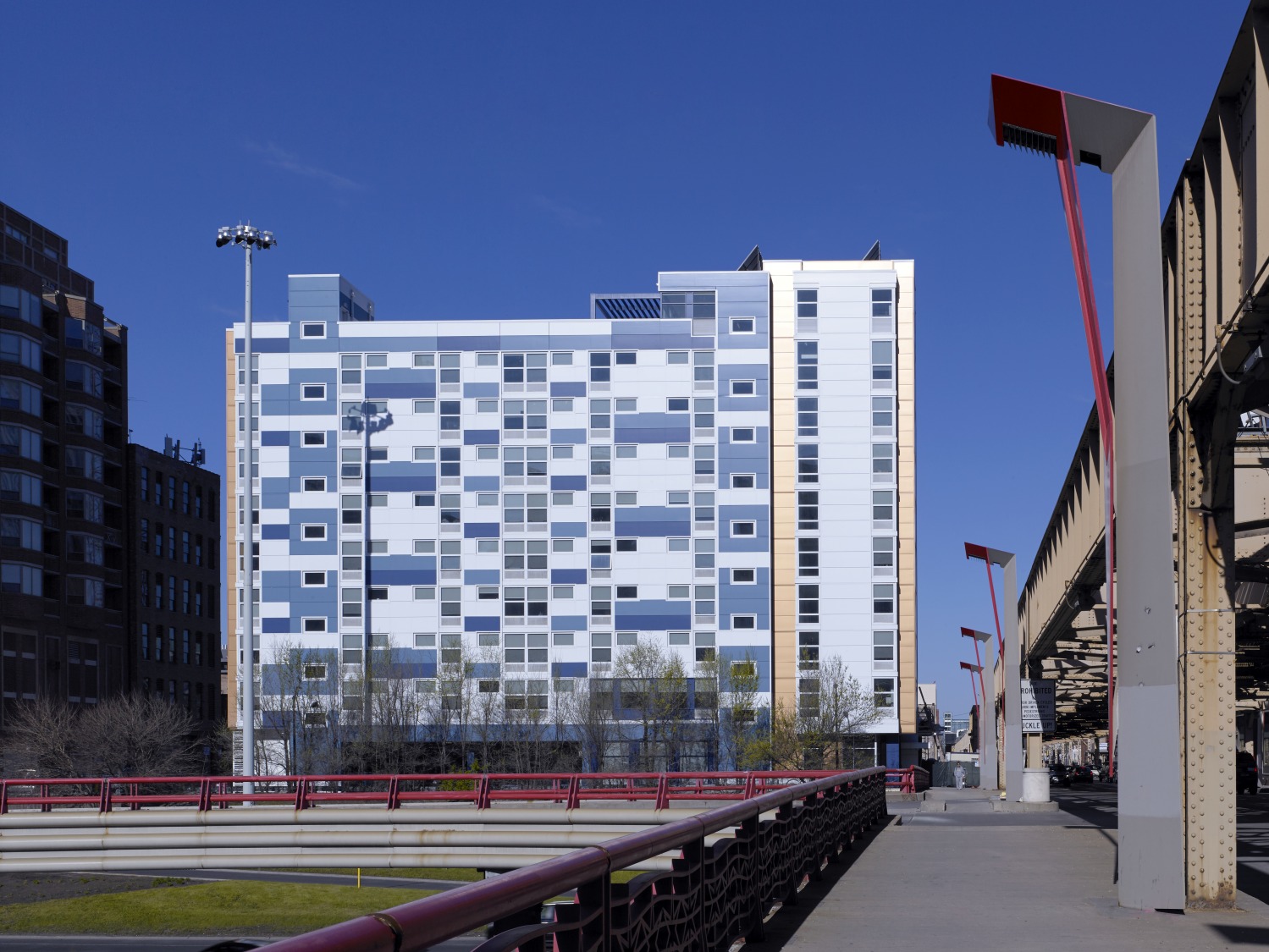 The blue and white exterior of the Lake Street Studios micro-apartment building in Chicago, Illinois.