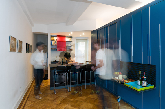 The home bar inside of the blue mini storage unit/storage locker from Unfolding Apartment, a small studio located in Manhattan, NY.