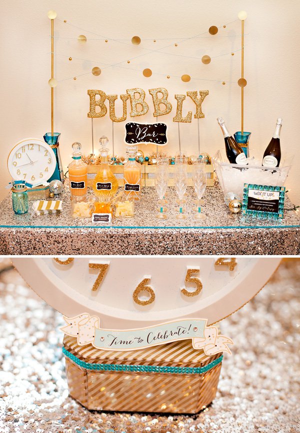 A DIY bar table has a gold sparkly "Bubbly" sign makes for a fun NYE party.