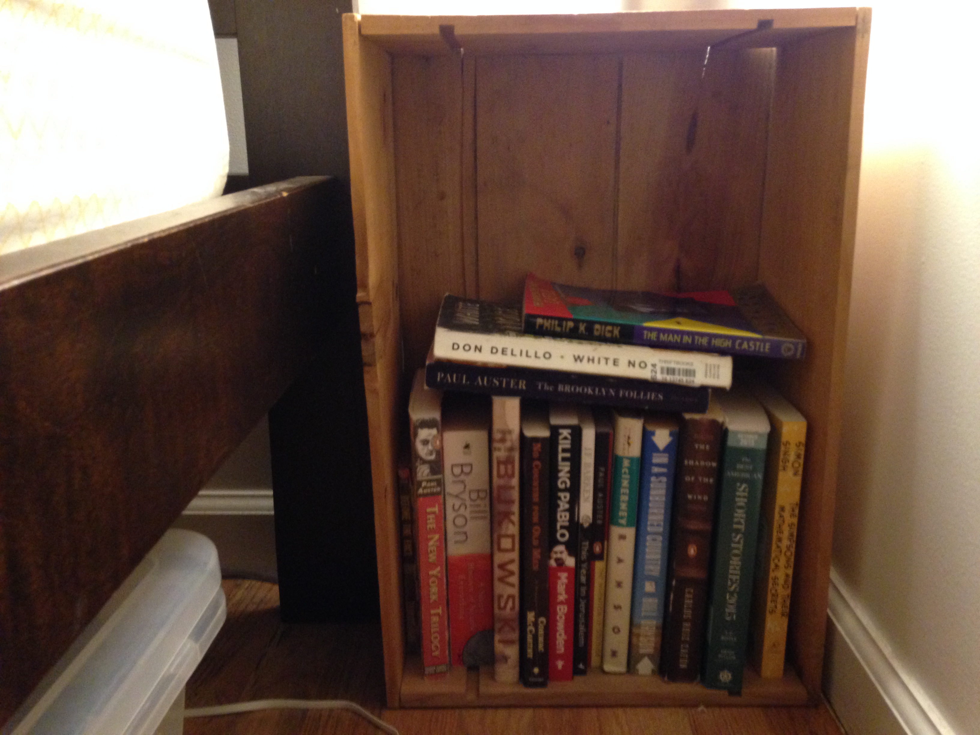 A DIY wooden crate used for book storage.