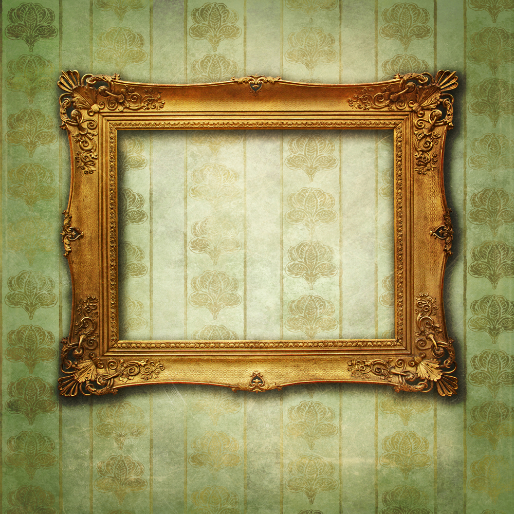 An empty golden vintage frame is mounted to a wall-papered wall, which serves as unique art.