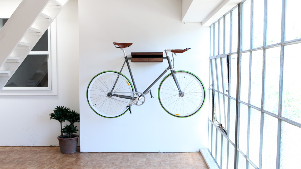 Hanging a bicycle on a Bike Shelf is a quick decorating idea to make an apartment look bigger.