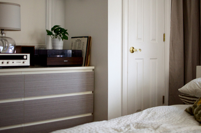 How to move from a house into a tiny NYC apartment: IKEA hack a MALM dresser into a TV stand/entertainment center.