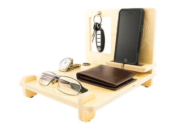 Moving to NYC tip: organize an iPhone, wallet, keys, a watch, and sunglasses on a docking station/desk organizer.