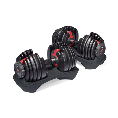 A pair of Bowflex SelectTech 552 Dumbbells are stored in their dumbbell stands.