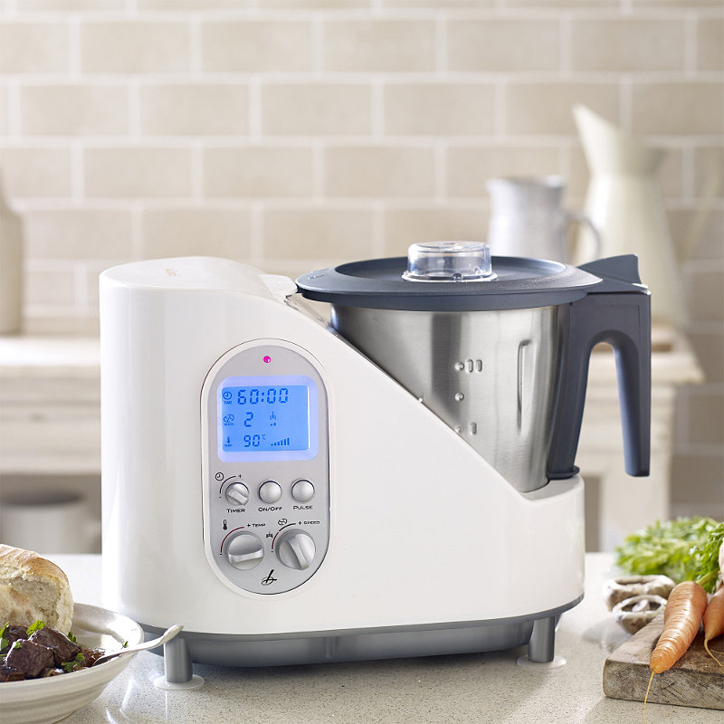 The Lakeland Multichef, which is a multi-functional kitchen appliance, is on a small kitchen counter.