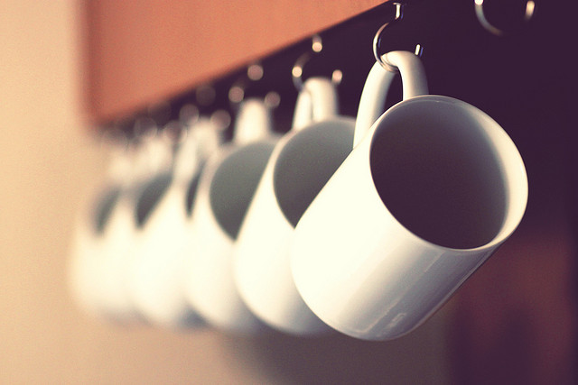 Save space in a kitchen by installing hooks for coffee mug storage.