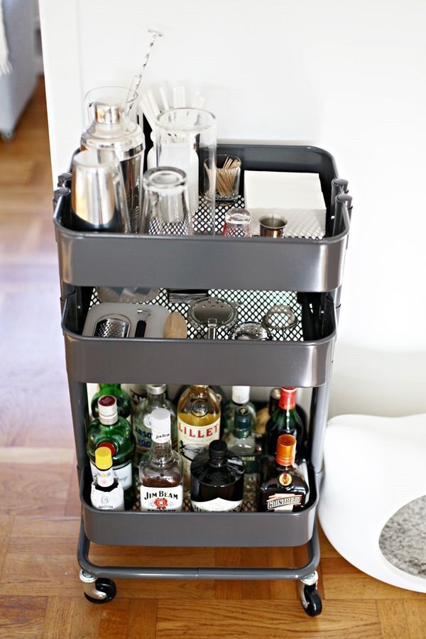 Easy IKEA Hack: Raskog utility cart used as a portable bar cart in a small apartment.