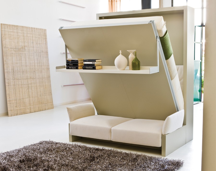 A Nuovoliola murphy bed from Resource Furniture that includes a sofa and storage shelf.