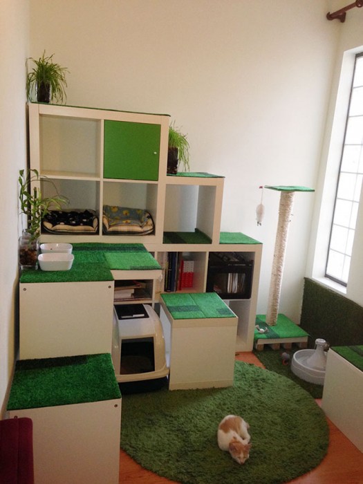 An IKEA hack/cat apartment/storage shelves made of KALLAX shelving.