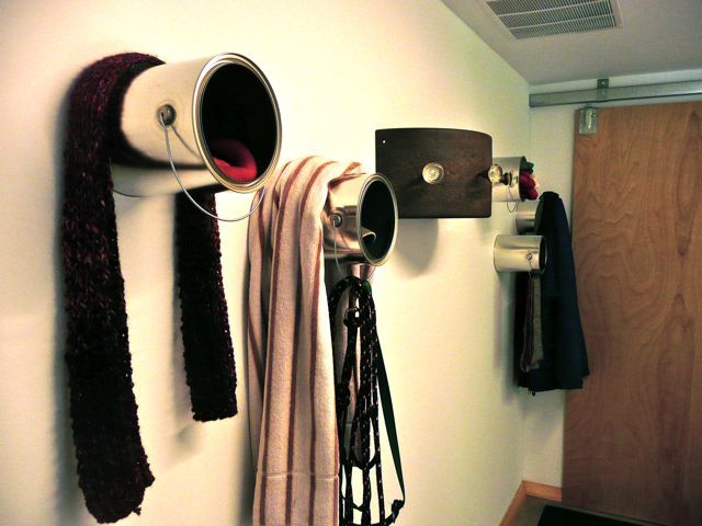 DIY scarf, winter hat, jacket, coat, gloves, and dog leash storage made of upcycled paint cans.