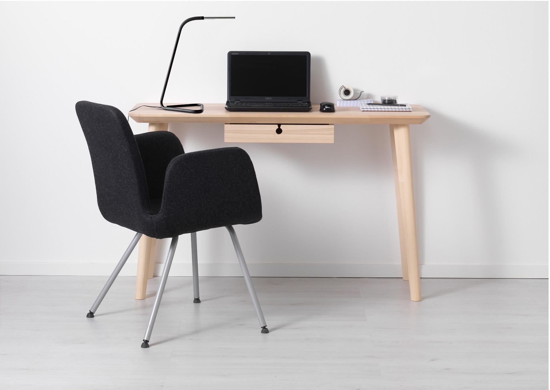 To share a tiny apartment with a boyfriend or girlfriend, downsize to a smaller desk like LISABO from IKEA.