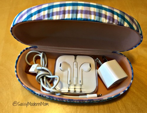An easy storage hack is storing an iPhone charger, cable, and headphones in a sunglasses case or eyeglasses case.