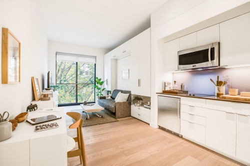 The clean, minimal, and furnished interior of Carmel Place, NYC's first micro-apartment building, which is located at 335 E 27th St in Kips Bay, Manhattan.