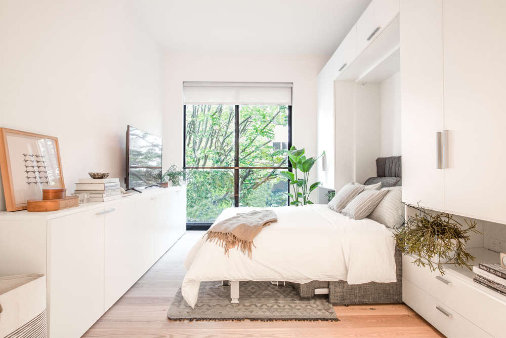 An open Murphy bed in one of Carmel Place's micro-apartments.