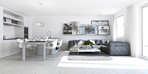 A white interior in a studio apartment reflects light to make a room feel bigger.