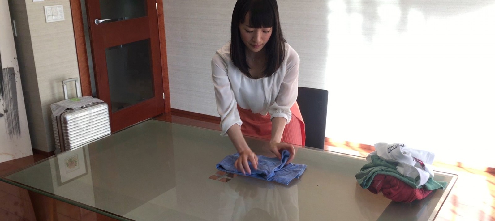 Marie Kondo shows how to fold a shirt the KonMari way.