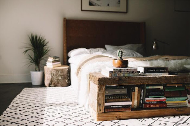 A creative book storage hack is building a baseboard that has convenient storage space for books.