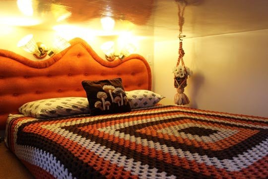 The cozy bedroom in Tracy and Marty Metro's "Retro Metro" houseboat.