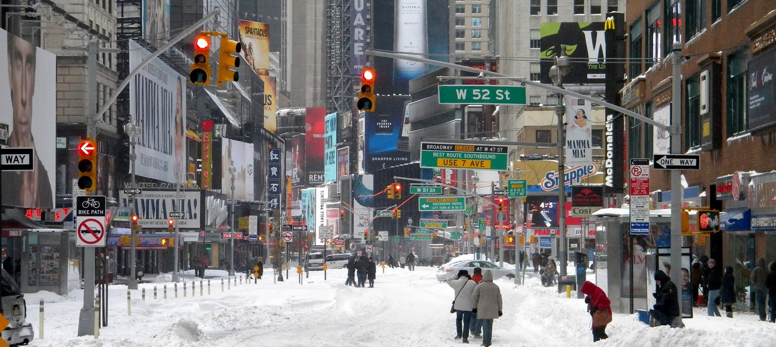 How to beat cabin fever: play in the snow at W 52nd St in Times Square, Manhattan.