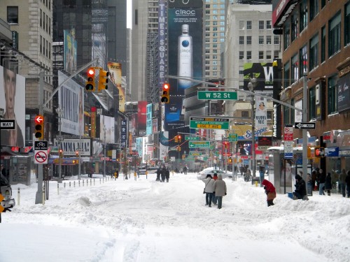 How to beat cabin fever: play in the snow at W 52nd St in Times Square, Manhattan.