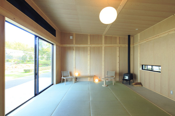 The interior of a MUJI Cork Hut, a minimal prefab house in Japan.