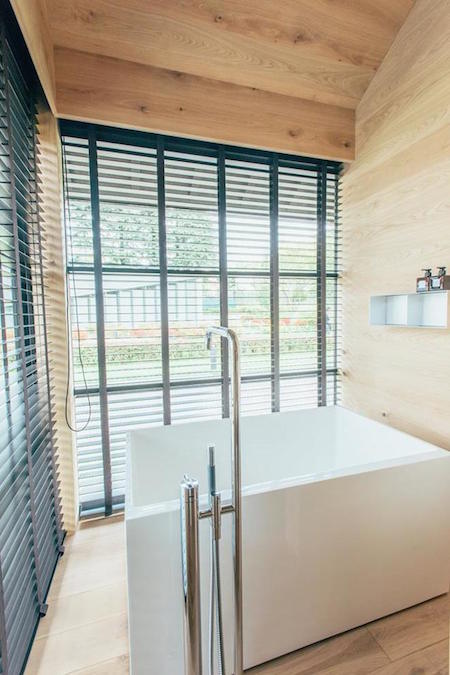 The interior of a MUJI Wooden Hut, a minimal prefab home built in Japan.