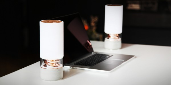 A Bluetooth Pavilion small speaker made of oak, copper, concrete, and clear polycarbonate.