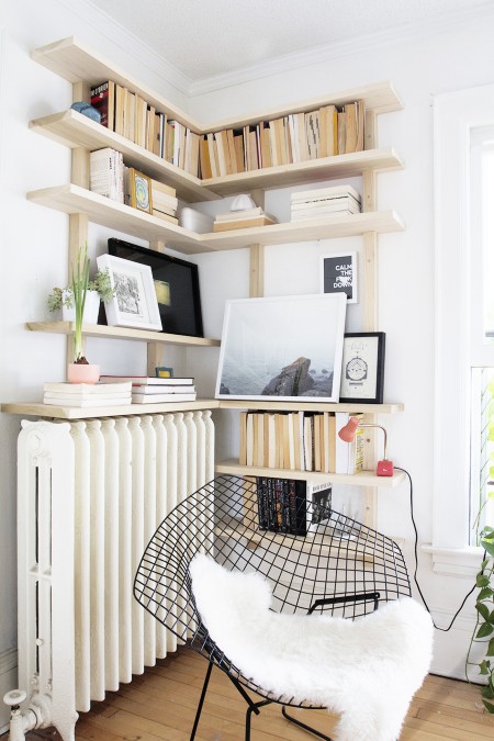 wood diy storage shelves in the corner of room